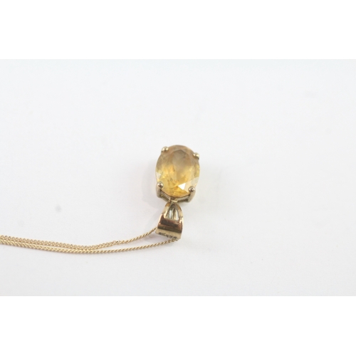 144 - 9ct gold citrine single stone pendant on chain (1.1g)