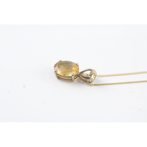 144 - 9ct gold citrine single stone pendant on chain (1.1g)