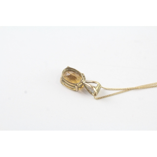 144 - 9ct gold citrine single stone pendant on chain (1.1g)