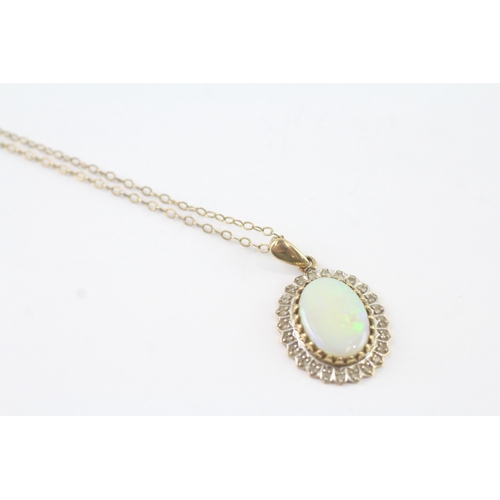 148 - 9ct gold opal and diamond halo pendant on chain (3.8g)