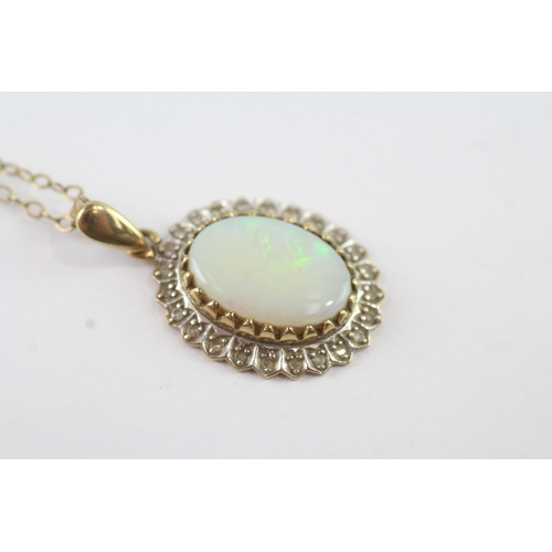 148 - 9ct gold opal and diamond halo pendant on chain (3.8g)