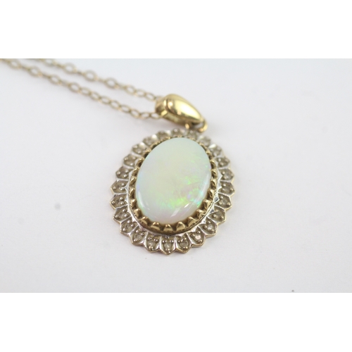 148 - 9ct gold opal and diamond halo pendant on chain (3.8g)