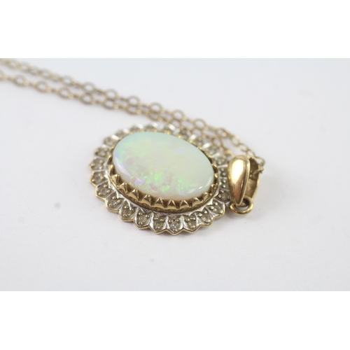 148 - 9ct gold opal and diamond halo pendant on chain (3.8g)