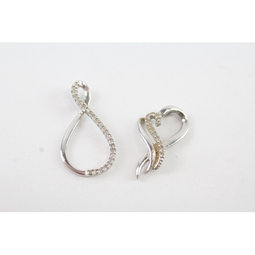 150 - 9ct white gold x2 diamond twist heart set (1.4g)