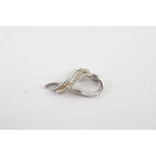 150 - 9ct white gold x2 diamond twist heart set (1.4g)