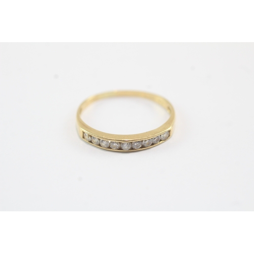 173 - 18ct gold nine stone channel set eternity band (1.3g) Size K