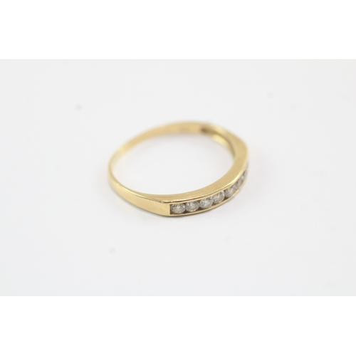 173 - 18ct gold nine stone channel set eternity band (1.3g) Size K