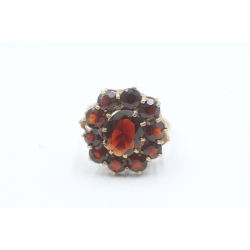 187 - 9ct gold garnet halo ring (3.7g) Size O