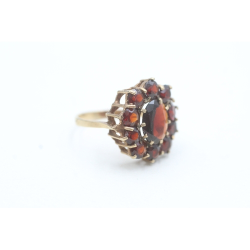 187 - 9ct gold garnet halo ring (3.7g) Size O