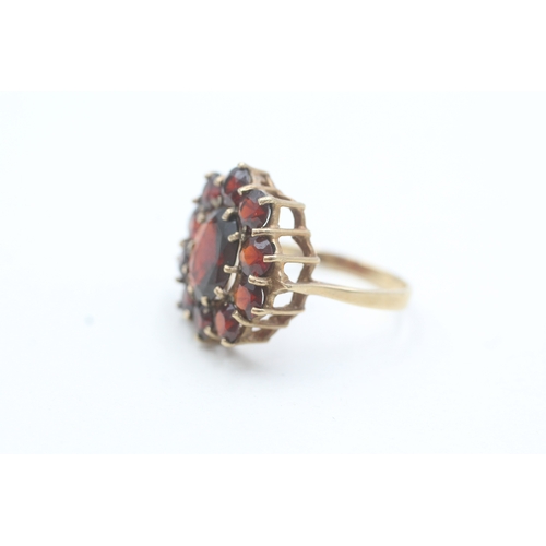 187 - 9ct gold garnet halo ring (3.7g) Size O