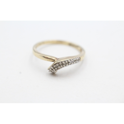 189 - 2 x 9ct gold diamond twist rings (3.8g)