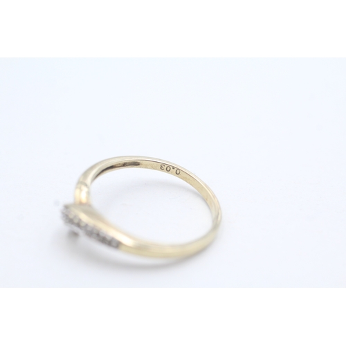 189 - 2 x 9ct gold diamond twist rings (3.8g)