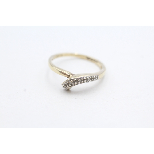 189 - 2 x 9ct gold diamond twist rings (3.8g)