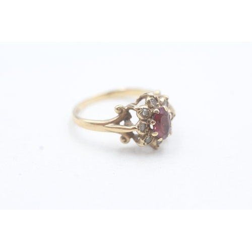 192 - 9ct gold diamond & red gemstone cluster dress ring (2.1g) Size J