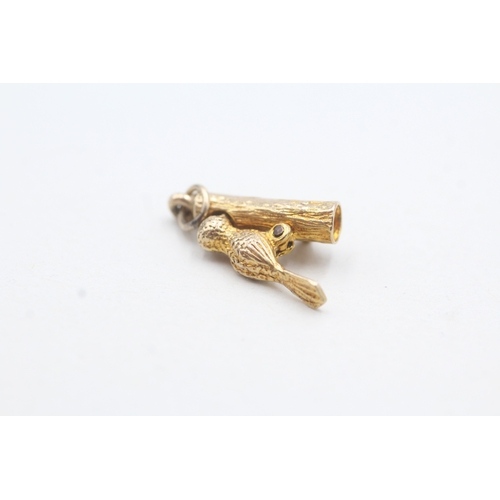 194 - 9ct gold wood pecker charm (2.5g)