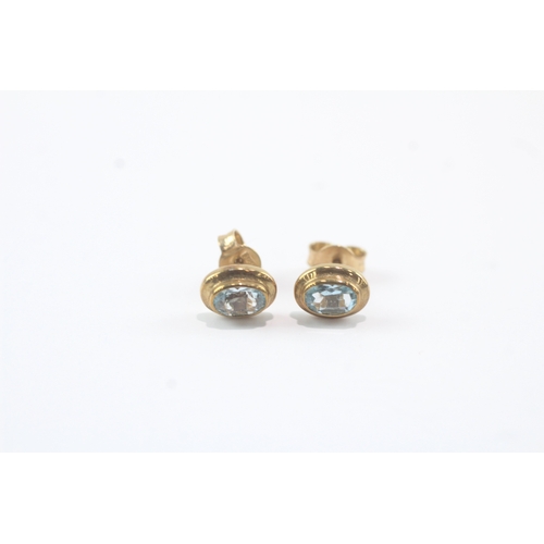 49 - 9ct gold blue topaz stud earrings (1.8g)