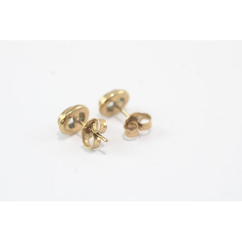 49 - 9ct gold blue topaz stud earrings (1.8g)