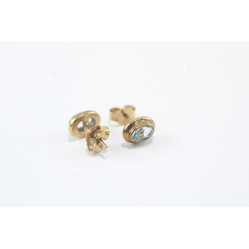 49 - 9ct gold blue topaz stud earrings (1.8g)