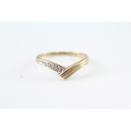 56 - 9ct gold diamond bypass dress ring (1.6g) Size N