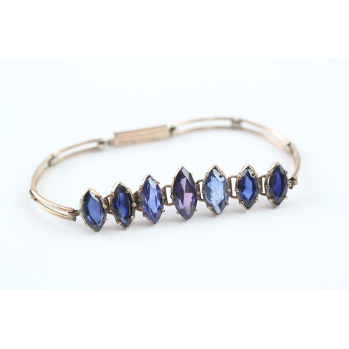 63 - 9ct gold vari-hue sapphire bracelet (6.5g)