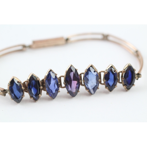 63 - 9ct gold vari-hue sapphire bracelet (6.5g)