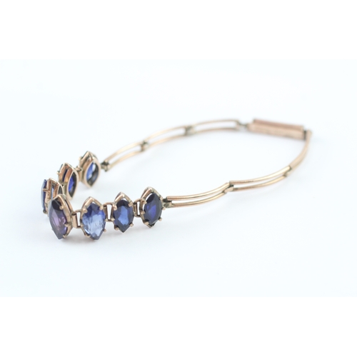 63 - 9ct gold vari-hue sapphire bracelet (6.5g)