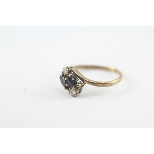 69 - 9ct gold diamond & sapphire four stone dress ring (1.4g) Size L