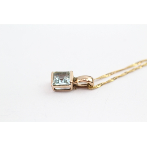 71 - 9ct gold blue gemstone pendant necklace (1.8g)