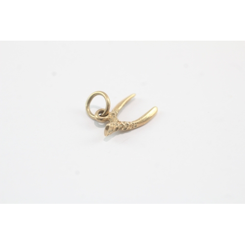 81 - 9ct gold wish bone charm (0.6g)