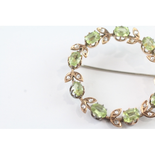 86 - 9ct gold vintage peridot and diamond halo brooch (6.8g)