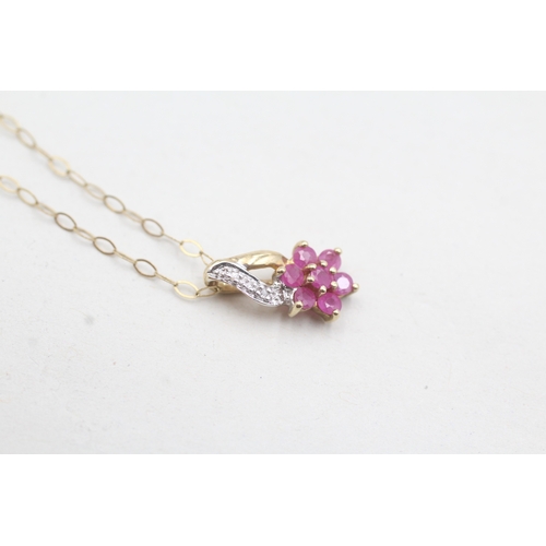 101 - 9ct gold diamond and ruby set floral pendant and chain (1g)