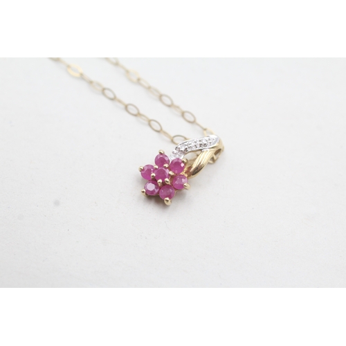 101 - 9ct gold diamond and ruby set floral pendant and chain (1g)