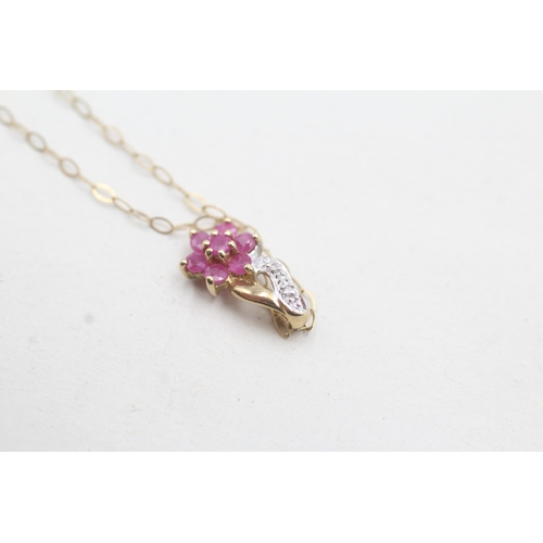 101 - 9ct gold diamond and ruby set floral pendant and chain (1g)