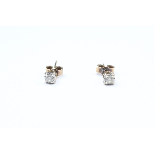 11 - 9ct gold diamond stud earrings (1g)