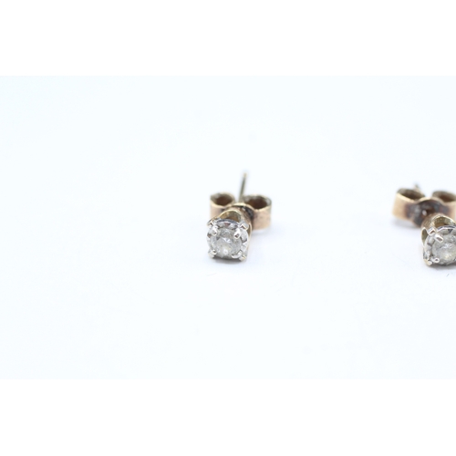 11 - 9ct gold diamond stud earrings (1g)