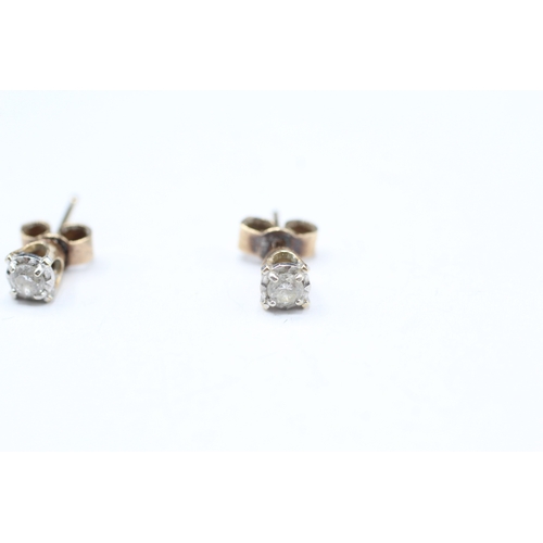 11 - 9ct gold diamond stud earrings (1g)