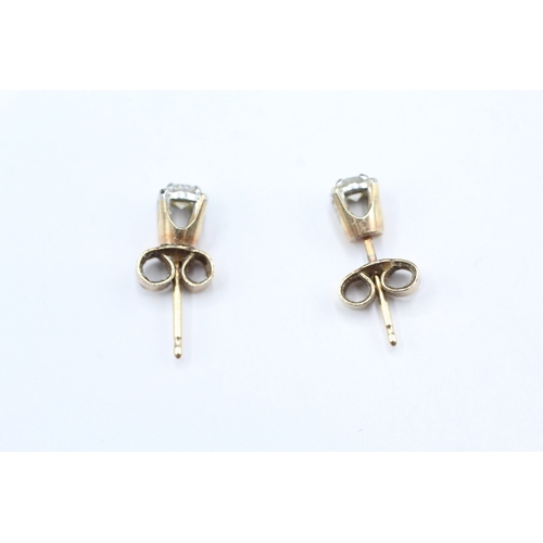 11 - 9ct gold diamond stud earrings (1g)