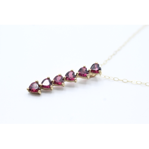 130 - 9ct gold purple gemstone heart drop pendant on chain (1.6g)