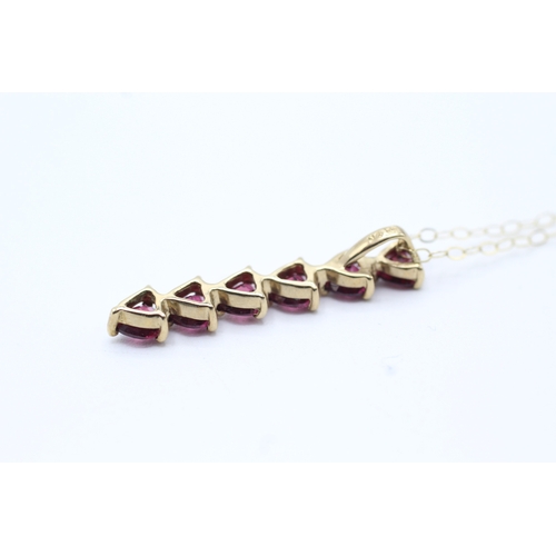 130 - 9ct gold purple gemstone heart drop pendant on chain (1.6g)