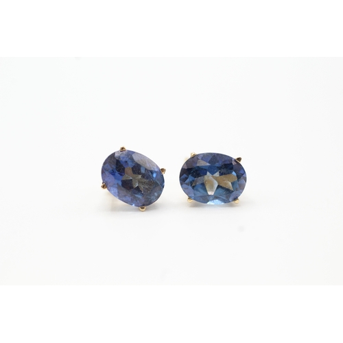 131 - 9ct gold blue gemstone stud earrings (1.9g)