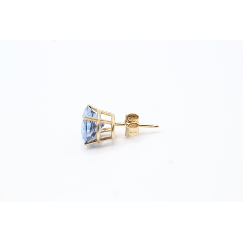 131 - 9ct gold blue gemstone stud earrings (1.9g)