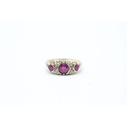 133 - 9ct gold vintage diamond and ruby set dress ring (2.8g) Size L