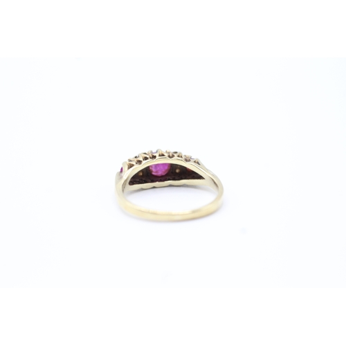 133 - 9ct gold vintage diamond and ruby set dress ring (2.8g) Size L