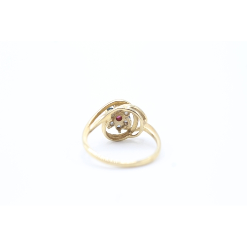 134 - 9ct gold ruby and blue gemstone set floral cluster ring (2.6g) Size N