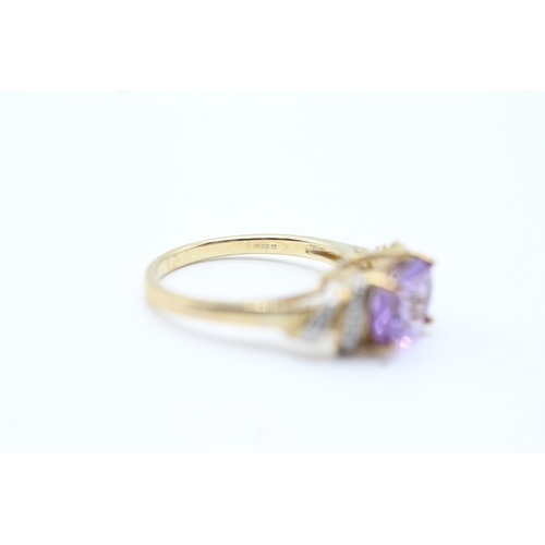 143 - 9ct gold diamond accented amethyst set cocktail ring (3.1g) Size N