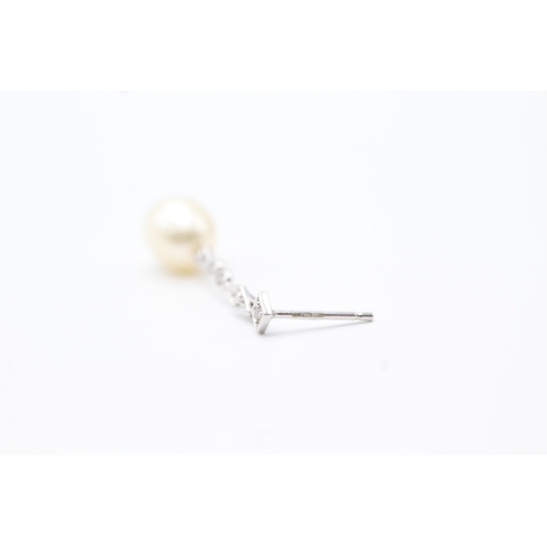 144 - 9ct gold diamond and pearl drop earrings (2.2g)