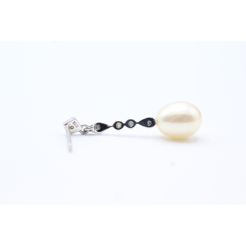 144 - 9ct gold diamond and pearl drop earrings (2.2g)