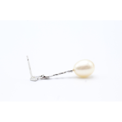 144 - 9ct gold diamond and pearl drop earrings (2.2g)