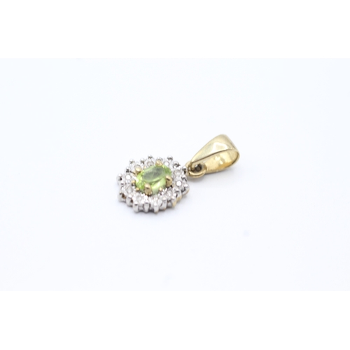 146 - 9ct gold green gemstone and diamond halo pendant (1.6g)