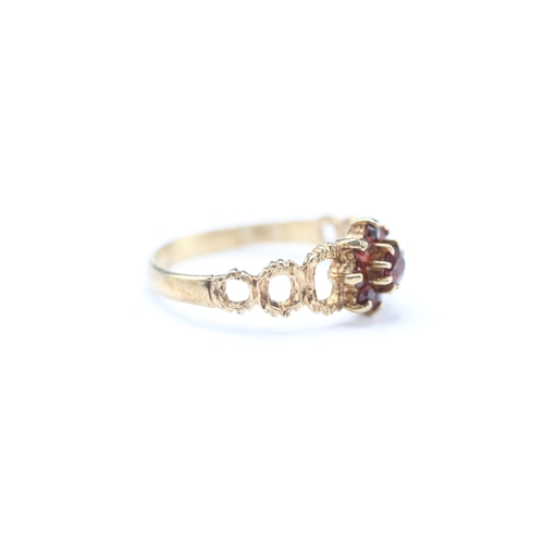 158 - 9ct gold garnet posy ring (2g) Size O